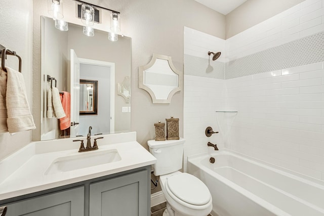 bathroom featuring visible vents, shower / bathing tub combination, vanity, and toilet