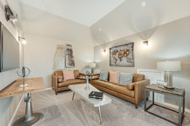 living room with baseboards, vaulted ceiling, and light colored carpet