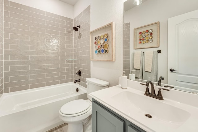 bathroom with vanity, bathtub / shower combination, and toilet