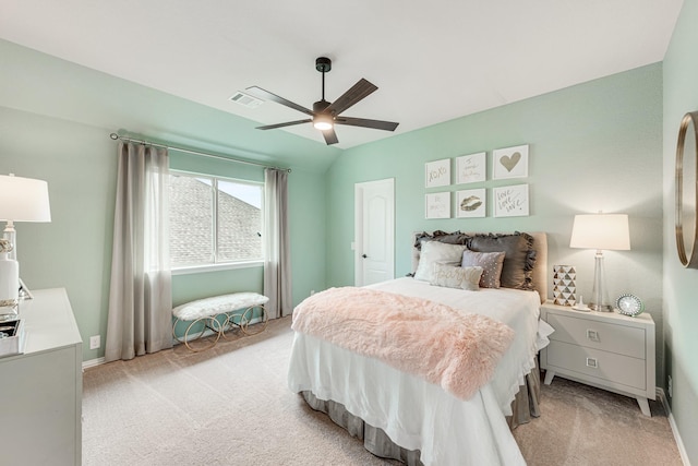 bedroom featuring light carpet, visible vents, a ceiling fan, and lofted ceiling