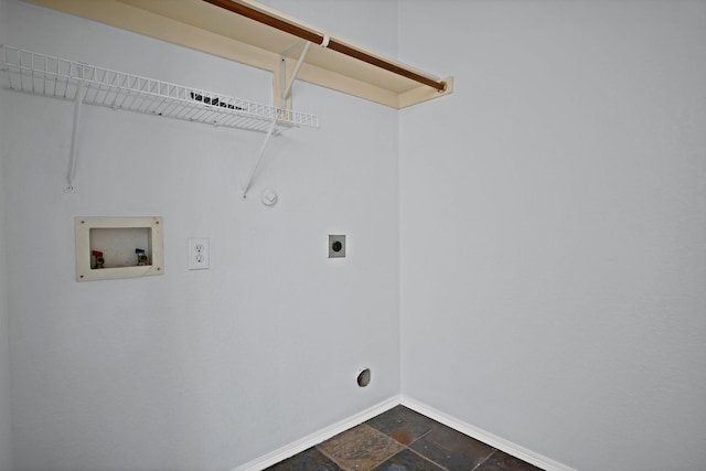 washroom featuring hookup for an electric dryer, laundry area, washer hookup, baseboards, and stone tile flooring