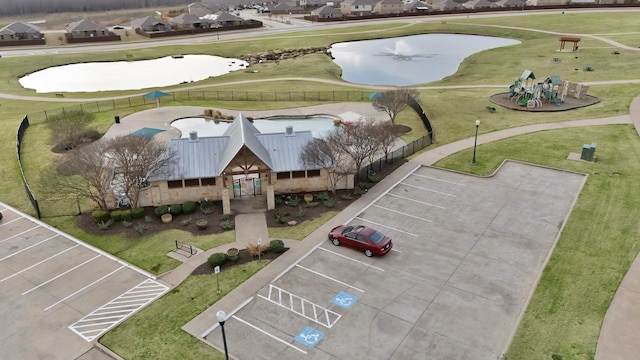 bird's eye view with a water view and a residential view