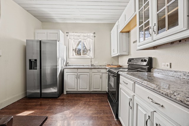 kitchen with glass insert cabinets, dark wood-style flooring, light stone countertops, black electric range, and stainless steel refrigerator with ice dispenser