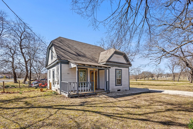 view of front of home featuring crawl space, roof with shingles, a front lawn, and covered porch