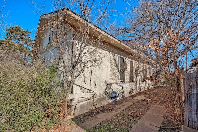 view of side of home featuring crawl space