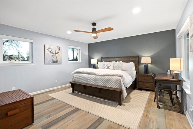 bedroom with a ceiling fan, recessed lighting, baseboards, and wood finished floors