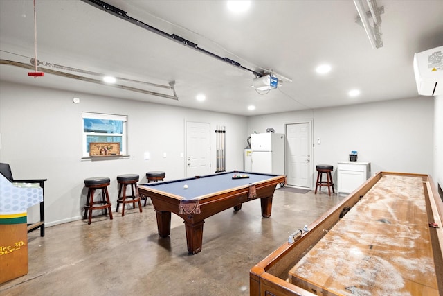 game room featuring a garage, billiards, finished concrete floors, and recessed lighting