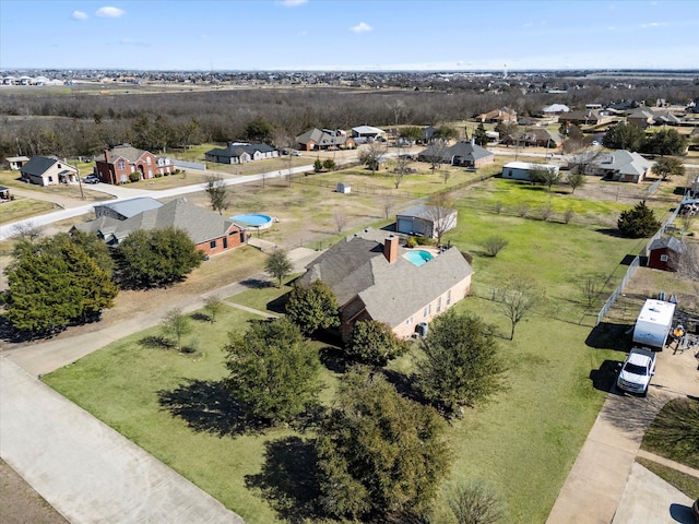 birds eye view of property with a residential view