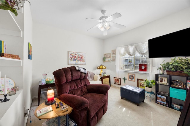 carpeted living room featuring ceiling fan