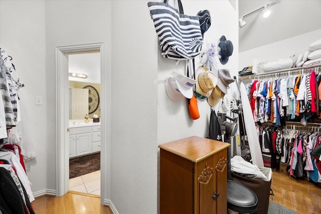 spacious closet with light wood finished floors