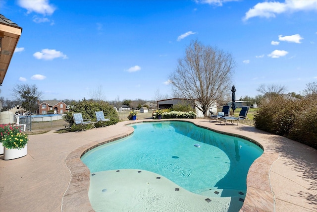 outdoor pool with a patio