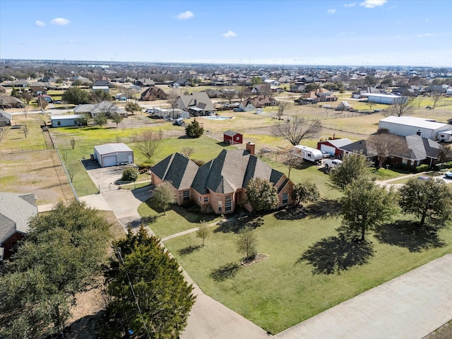 birds eye view of property with a residential view