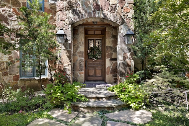 view of exterior entry with stone siding