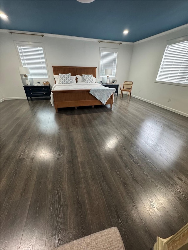 unfurnished bedroom with baseboards, dark wood-style flooring, and ornamental molding