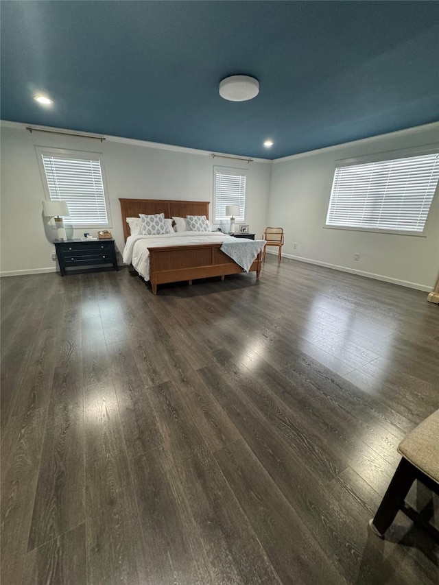 unfurnished bedroom featuring recessed lighting, dark wood-style flooring, and baseboards