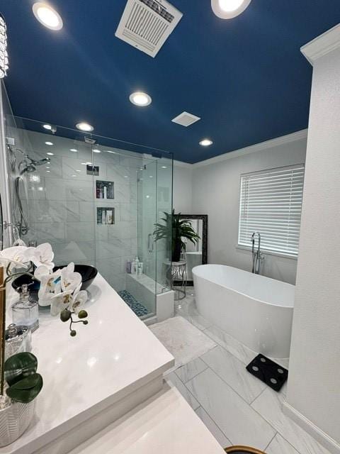 full bath with a freestanding tub, visible vents, marble finish floor, ornamental molding, and a stall shower