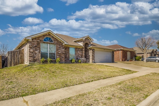 ranch-style home featuring driveway, an attached garage, a front yard, and brick siding