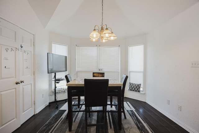 dining room with a chandelier, baseboards, dark wood finished floors, and a healthy amount of sunlight