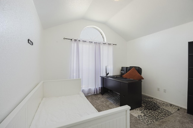 bedroom with carpet floors and lofted ceiling