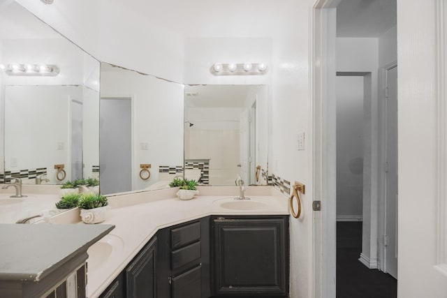 bathroom with double vanity and a sink