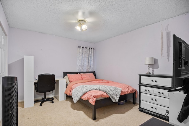 carpeted bedroom featuring a textured ceiling