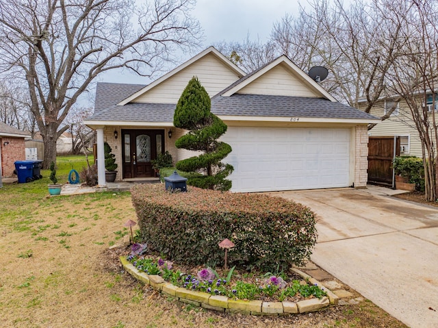 view of front of home with a garage, driveway, roof with shingles, fence, and brick siding