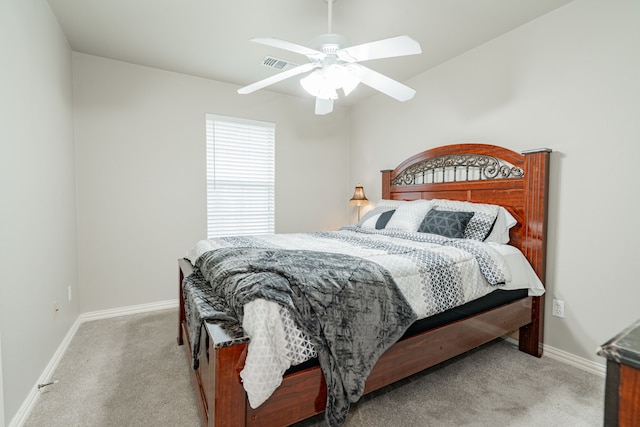 bedroom with light colored carpet, visible vents, and baseboards