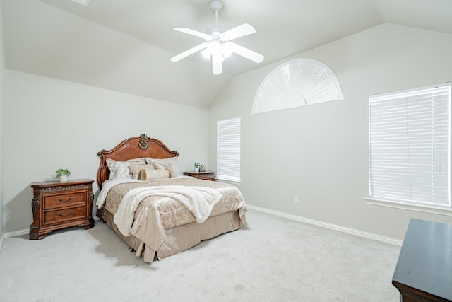 carpeted bedroom featuring lofted ceiling, ceiling fan, and baseboards