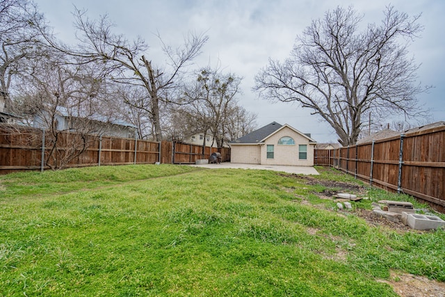 view of yard featuring a patio area and a fenced backyard