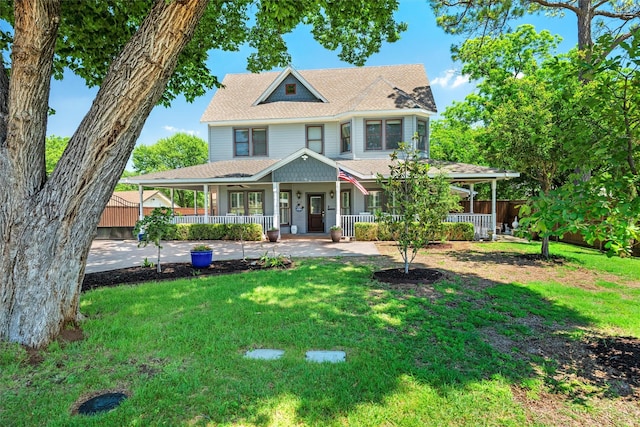 view of front facade featuring a porch and a front yard