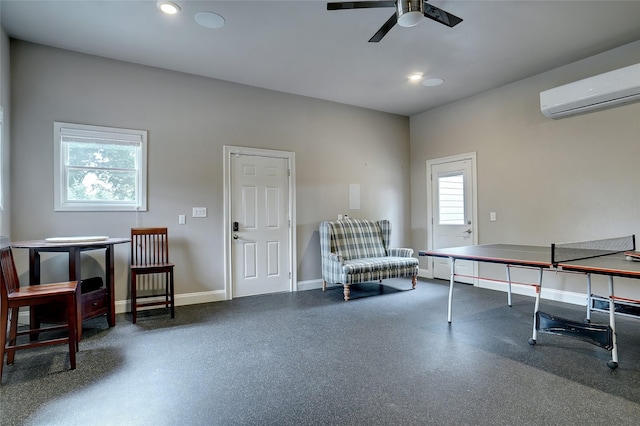 rec room featuring a ceiling fan, recessed lighting, baseboards, and a wall mounted AC