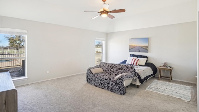 carpeted bedroom featuring ceiling fan and baseboards