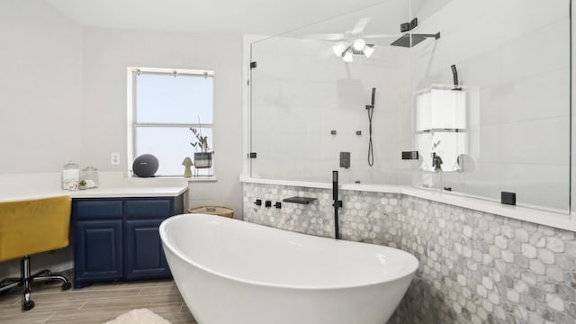 bathroom featuring a freestanding tub, a walk in shower, and wood tiled floor