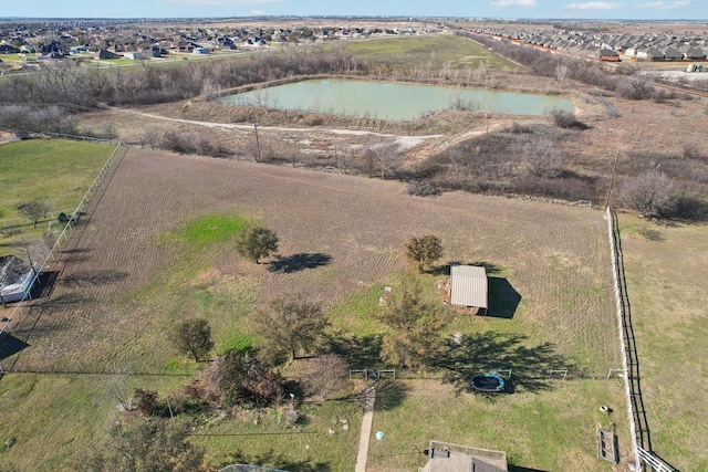 drone / aerial view featuring a water view and a rural view