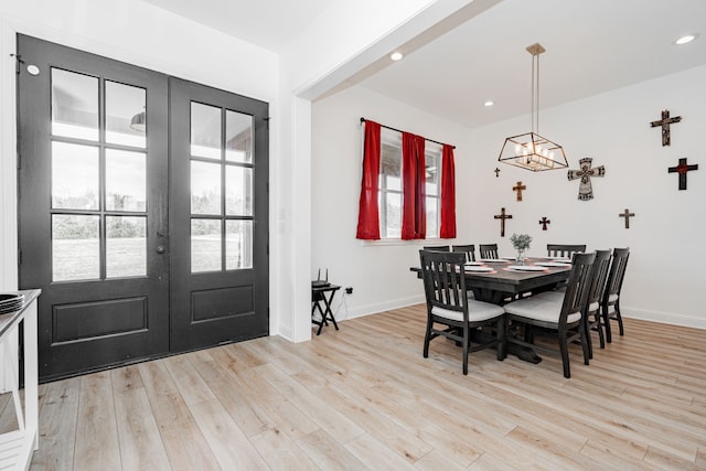 dining area with light wood finished floors, french doors, recessed lighting, and baseboards