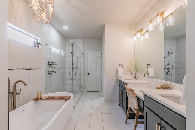 bathroom with a shower stall, a freestanding tub, double vanity, and a sink