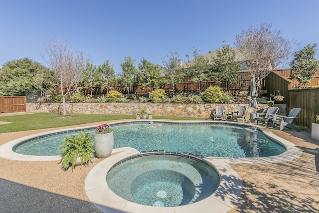 view of pool with a patio area, a lawn, a fenced backyard, and a pool with connected hot tub