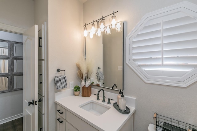 bathroom featuring toilet and vanity