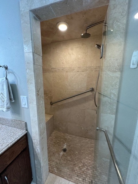 8701 Woodstream Dr, Frisco, TX 75034 - bathroom featuring tiled shower and vanity