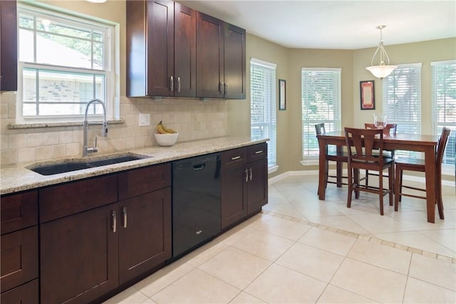 kitchen with light tile patterned floors, black dishwasher, decorative backsplash, and a sink