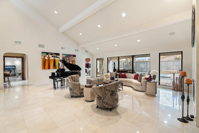 living room with arched walkways, beam ceiling, marble finish floor, visible vents, and high vaulted ceiling