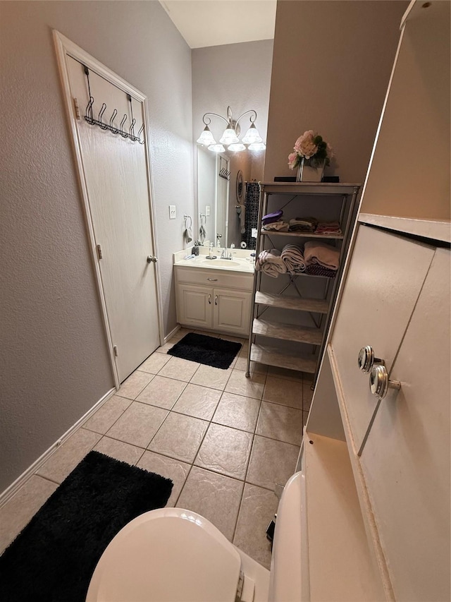 bathroom featuring tile patterned flooring and vanity