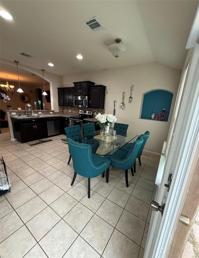 dining space featuring lofted ceiling, light tile patterned floors, visible vents, and recessed lighting