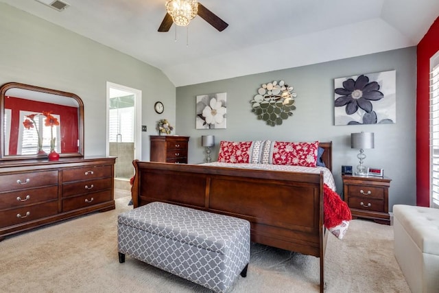 bedroom with visible vents, a ceiling fan, lofted ceiling, ensuite bathroom, and carpet flooring