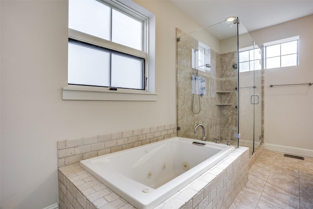 full bathroom with a shower stall, a tub with jets, visible vents, and a wealth of natural light