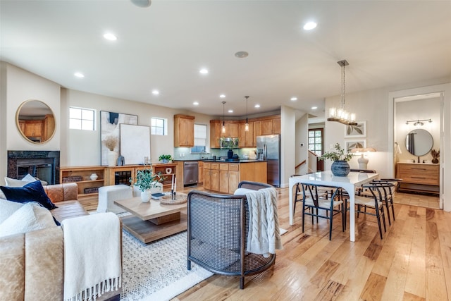 living area featuring light wood finished floors and recessed lighting