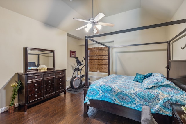 bedroom featuring a ceiling fan, baseboards, vaulted ceiling, and hardwood / wood-style floors