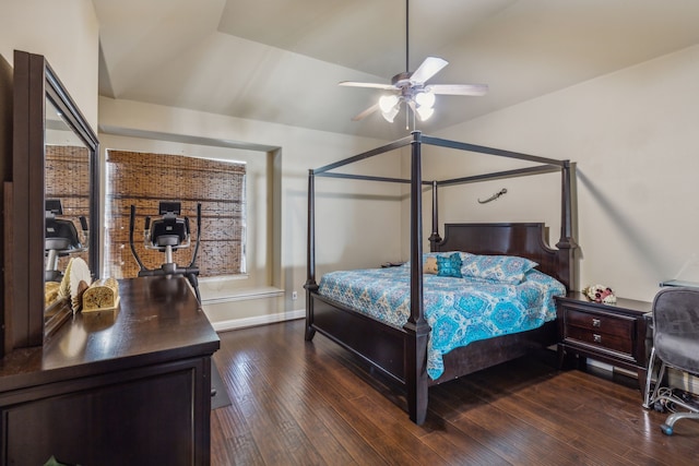 bedroom with lofted ceiling, hardwood / wood-style floors, and baseboards