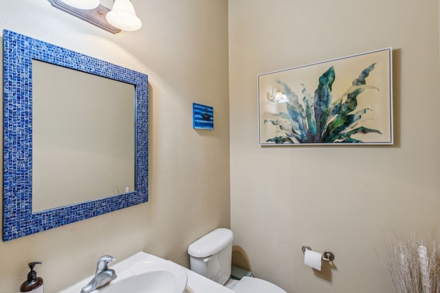 bathroom featuring a sink and toilet