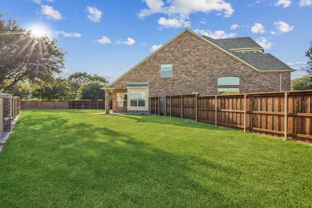 view of yard with a fenced backyard